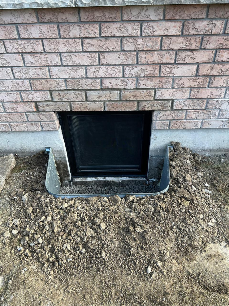 Egress window from outside upgraded with black color on outside project by sv constructions and services inc.